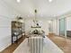Elegant dining room with stylish decor, a long dining table and modern lighting at 8111 Farm Crossing Ln # 2, Huntersville, NC 28078