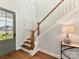 Inviting entryway with hardwood floors, staircase and stylish decor; shows the start of a warm and welcoming home at 8111 Farm Crossing Ln # 2, Huntersville, NC 28078