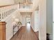 Grand foyer featuring hardwood floors, staircase, and elegant lighting fixture at 8111 Farm Crossing Ln # 2, Huntersville, NC 28078