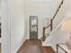 Welcoming foyer with hardwood floors, staircase, and a view of the exterior at 8111 Farm Crossing Ln # 2, Huntersville, NC 28078