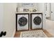 Efficient laundry room with side by side washer and dryer and a clean, organized layout for easy chores at 8111 Farm Crossing Ln # 2, Huntersville, NC 28078