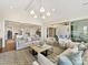 Open-concept living room with seamless flow to the kitchen and outdoor patio at 8111 Farm Crossing Ln # 2, Huntersville, NC 28078