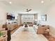 Spacious living room with large windows, ceiling fan, neutral color palette, and comfortable seating arrangement at 8111 Farm Crossing Ln # 2, Huntersville, NC 28078