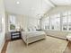 Serene primary bedroom with vaulted ceiling, plantation shutters, and elegant decor at 8111 Farm Crossing Ln # 2, Huntersville, NC 28078