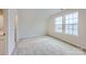 Bright bedroom with carpet flooring and two large windows at 4450 Doyle Ridge Rd, Maiden, NC 28650