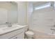 Simple bathroom with white vanity, toilet, and shower/tub at 4456 Doyle Ridge Rd, Maiden, NC 28650