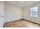 Well-lit bedroom with hardwood floors and a window at 4456 Doyle Ridge Rd, Maiden, NC 28650