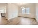 Bright dining room with hardwood floors and wainscoting at 4456 Doyle Ridge Rd, Maiden, NC 28650