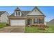 Brick and shingle ranch home with a two-car garage and landscaped lawn at 4456 Doyle Ridge Rd, Maiden, NC 28650