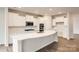 Modern kitchen with white cabinets, quartz countertops, and an island at 4456 Doyle Ridge Rd, Maiden, NC 28650