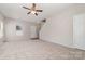 Bright living room featuring neutral paint and carpeting at 4803 Roxfield Ln, Charlotte, NC 28215