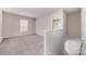 Spacious loft area with neutral carpet, plenty of natural light, and staircase access at 4803 Roxfield Ln, Charlotte, NC 28215