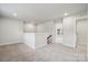 Spacious hallway filled with natural light, leading to multiple rooms and offering a glimpse of the staircase at 9916 Manor Vista Trl, Kannapolis, NC 28027