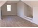 Bonus Room with wood floors and a staircase at 104 Arbor Dr, Waxhaw, NC 28173