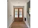 Bright entryway featuring wood floors and a double door entry at 104 Arbor Dr, Waxhaw, NC 28173