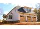 Exterior elevation of home, featuring wood siding and garage at 104 Arbor Dr, Waxhaw, NC 28173