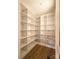 Custom walk-in pantry featuring custom shelving and ample storage at 104 Arbor Dr, Waxhaw, NC 28173