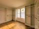 Large walk-in closet with custom organizers and wood flooring at 104 Arbor Dr, Waxhaw, NC 28173