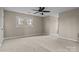 Well-lit bedroom with ceiling fan and carpet flooring at 17929 Pages Pond Ct, Davidson, NC 28036