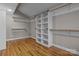 Large walk-in closet with built-in shelving and hanging rods at 17929 Pages Pond Ct, Davidson, NC 28036