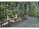 Wooden deck overlooking a wooded backyard with trees at 17929 Pages Pond Ct, Davidson, NC 28036