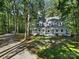 Two-story home with wrap-around porch and wooded setting at 17929 Pages Pond Ct, Davidson, NC 28036