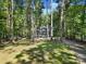 House exterior showcasing a spacious yard and driveway at 17929 Pages Pond Ct, Davidson, NC 28036