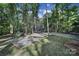 House exterior with gravel parking area and trees at 17929 Pages Pond Ct, Davidson, NC 28036