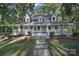 White two-story house with front porch and landscaping at 17929 Pages Pond Ct, Davidson, NC 28036