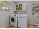 Laundry room with washer, dryer, and overhead storage at 17929 Pages Pond Ct, Davidson, NC 28036