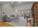 Living room with fireplace, hardwood floors, and access to deck at 17929 Pages Pond Ct, Davidson, NC 28036