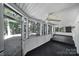 Screened porch with dark stained floor and ceiling fan at 17929 Pages Pond Ct, Davidson, NC 28036