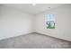 Bright bedroom with grey carpet and window with neighborhood view at 311 Bezelle Ave, York, SC 29745