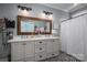 Clean bathroom with double vanity, patterned floor tile, and a shower/tub combo at 329 Wintergreen Ct, Kings Mountain, NC 28086