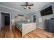 Main bedroom with a rustic wooden bed frame and plenty of natural light at 329 Wintergreen Ct, Kings Mountain, NC 28086