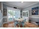 Charming dining area with a round table and white hutch at 329 Wintergreen Ct, Kings Mountain, NC 28086