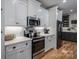 White kitchen cabinets and countertops, stainless steel appliances at 329 Wintergreen Ct, Kings Mountain, NC 28086