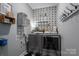 Laundry room with washer, dryer, and stylish decor at 329 Wintergreen Ct, Kings Mountain, NC 28086