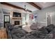 Living room with a fireplace, hardwood floors, and exposed beams at 329 Wintergreen Ct, Kings Mountain, NC 28086