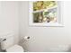 Simple, clean bathroom with window overlooking trees at 6920 Wyndbend Ln, Mint Hill, NC 28227