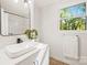 Bright bathroom with white subway tile, modern vanity, and large window at 6920 Wyndbend Ln, Mint Hill, NC 28227