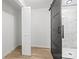 Bathroom with barn door and white subway tile shower at 6920 Wyndbend Ln, Mint Hill, NC 28227