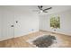 Spacious bedroom featuring wood floors and a large window at 6920 Wyndbend Ln, Mint Hill, NC 28227