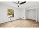 Spacious bedroom with ceiling fan, large window, and closet at 6920 Wyndbend Ln, Mint Hill, NC 28227