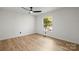 Bedroom with ceiling fan, window, and hardwood floors at 6920 Wyndbend Ln, Mint Hill, NC 28227