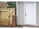 Exterior view showing a new wooden gate and white door at 6920 Wyndbend Ln, Mint Hill, NC 28227