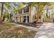 Two-story house with beige siding, black shutters, and a covered porch at 6920 Wyndbend Ln, Mint Hill, NC 28227