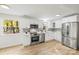 Modern kitchen with stainless steel appliances and white cabinets at 6920 Wyndbend Ln, Mint Hill, NC 28227