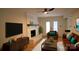 Living room with fireplace, built-in shelving, and comfortable seating at 6920 Wyndbend Ln, Mint Hill, NC 28227