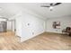 Spacious living area with light flooring and a view into the kitchen at 6920 Wyndbend Ln, Mint Hill, NC 28227